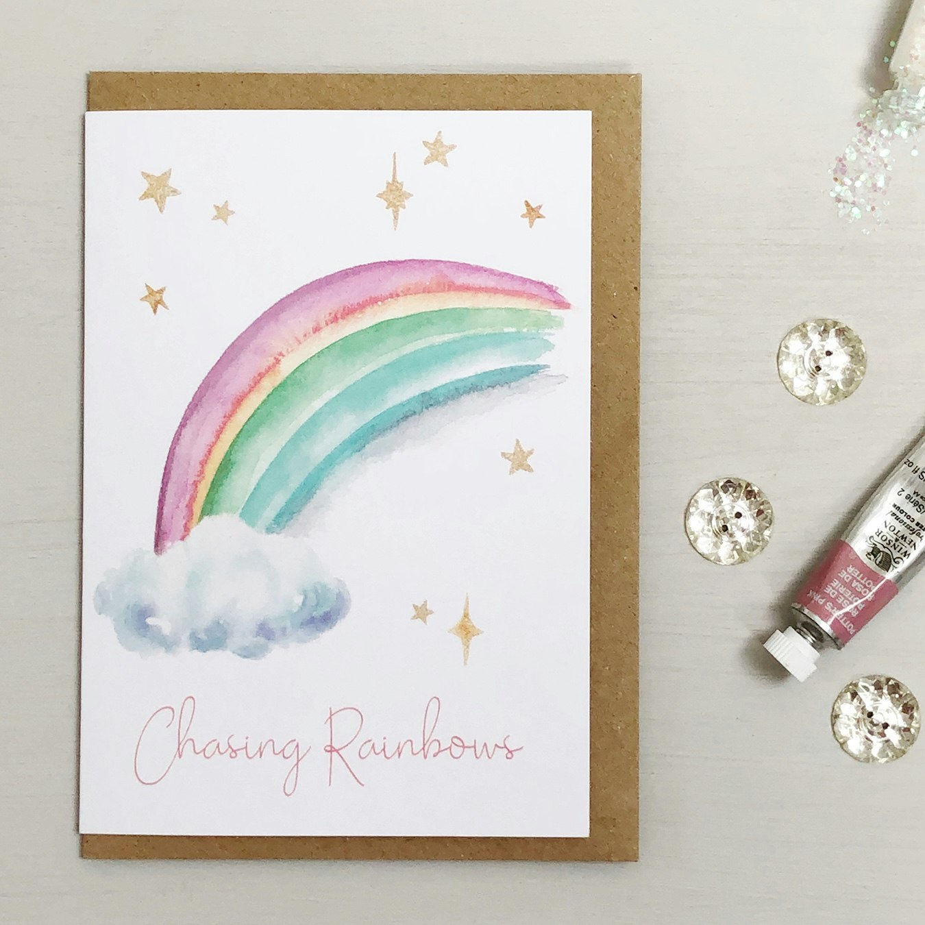 Chasing Rainbows Greeting Card by Katie Hipwell