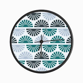 Geometric Pattern With Blue And Green Sunrise On Light Blue Clock