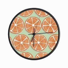Orange Slices Pattern On Pastel Green Clock