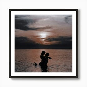 Couple In Water At Sunset Art Print