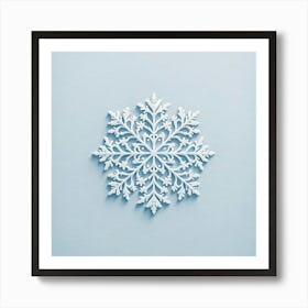 "Serene Snowflake Elegance"  A meticulously crafted paper snowflake adorns a soft blue background, offering a close-up view of its symmetrical design and intricate patterns. The art captures the transient and delicate essence of a winter's snowflake, translated into a permanent and enchanting piece.  Embrace the tranquility of a winter's day with this serene art, a testament to nature's perfection in design, inviting a sense of calm and contemplation into any space. Art Print