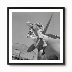 Repair Man Perched Upon Propeller Hub Of Airplane, Lake Muroc, California By Russell Lee Art Print
