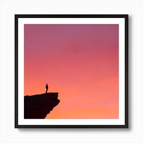 Silhouette Of A Man Standing On A Cliff Art Print