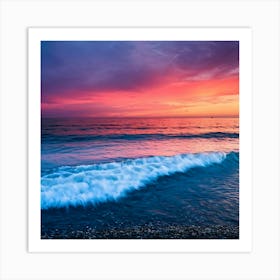 A fiery pink sky bleeds color into a calm, azure sea Art Print