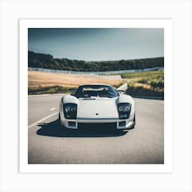 White Sports Car Driving Down A Road Art Print