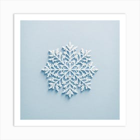 "Serene Snowflake Elegance"  A meticulously crafted paper snowflake adorns a soft blue background, offering a close-up view of its symmetrical design and intricate patterns. The art captures the transient and delicate essence of a winter's snowflake, translated into a permanent and enchanting piece.  Embrace the tranquility of a winter's day with this serene art, a testament to nature's perfection in design, inviting a sense of calm and contemplation into any space. Art Print