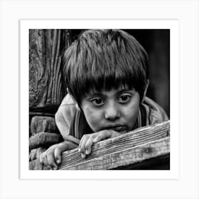 Boy Peeking Over A Fence Art Print