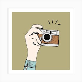 Hand Holding A Camera Art Print