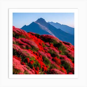 A Large Mountain With Red Flowers Stacked Below It And A Wide Blue Sky In The Background With No Tre (1) Art Print