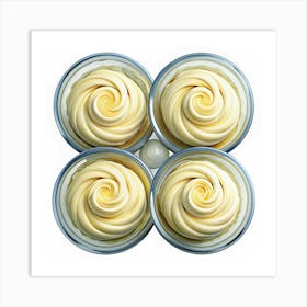 Four Swirls Of Yellow Cream In Glass Containers Art Print