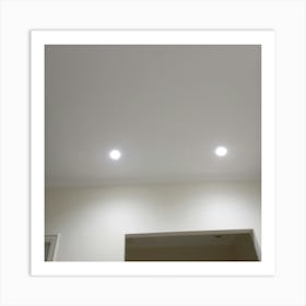The room I'm envisioning has a high ceiling and is illuminated with bright, modern lighting fixtures that are mounted on the ceiling. Art Print