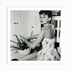 Audrey Hepburn Arranging Flowers In Kitchen Art Print