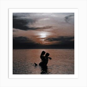 Couple In Water At Sunset Art Print