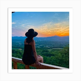 Woman In Black Hat Sitting Alone On A Wooden Balcony Overlooking A Hill Dotted Landscape Trees Al (5) Art Print