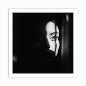 A Face Partially Illuminated Half Shrouded In Shadows Appears Through The Interplay Of Stark Light Art Print