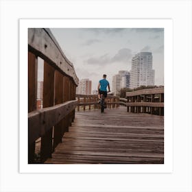 Man Riding Bike On Wooden Boardwalk Art Print