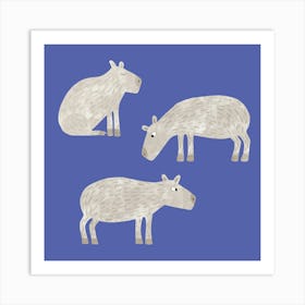 Three Capybara on a Blue Background Art Print