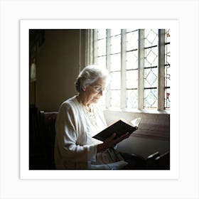 An Elderly Woman Of Faith Dressed In A White Cardigan Is Absorbed In Reading The Holy Bible Her H (6) Art Print