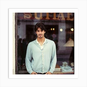 Young Spanish Man Posing In Front Of A Blurry Shop Window Captured With A Retro And Nostalgic Mood Art Print