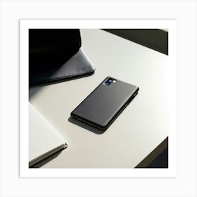 Leather Phone Case Rests On A White Table Paired With A Notebook And Ballpoint Pen In A Minimalist Art Print