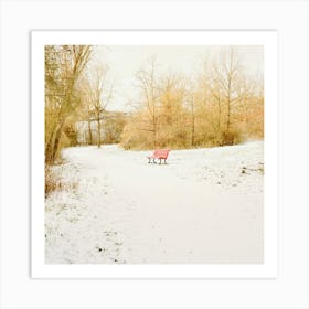 A red bench in the snow park Art Print