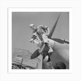 Repair Man Perched Upon Propeller Hub Of Airplane, Lake Muroc, California By Russell Lee Art Print