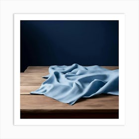 Blue Cloth On A Wooden Table Art Print