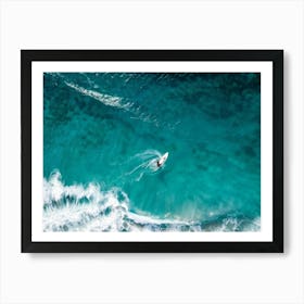 Aerial View Capturing A Single Surfer Carving Through The Azure Waves Silhouetted Against The Cryst Art Print