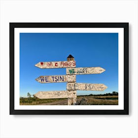 A Weathered Wooden Signpost At A Crossroad Its Arrows Pointing In Various Directions With Hand Pain (1) Art Print