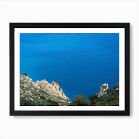 Blue sea water and cliffs on the coast Art Print