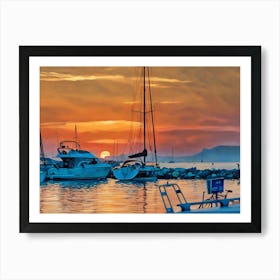 Sunset Harbor in Var Riviera. A picturesque scene of a harbor at sunset, with several sailboats docked along a rocky pier. The sky is ablaze with vibrant orange and red hues, with the sun partially obscured by clouds on the horizon. The water reflects the warm colors of the sky, creating a serene and tranquil atmosphere. The sailboats are silhouetted against the sunset, their masts reaching towards the sky. 3 Art Print