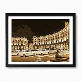 The lively Piazza della Repubblica in Rome at night. The image depicts a bustling city square at night, illuminated by warm streetlights. Two grand buildings, one curved and the other rectangular, flank the square, their facades adorned with intricate details and windows. The buildings are bathed in a soft, golden glow, creating a warm and inviting atmosphere. Art Print