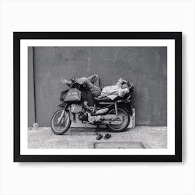 A Man Takes A Nap On His Bike Art Print