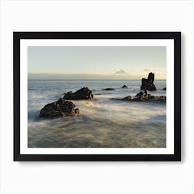 Wild coast with mountain silhouette in the evening light Art Print