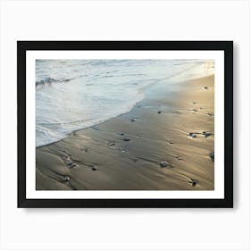 Sea water flows over shiny sand Art Print