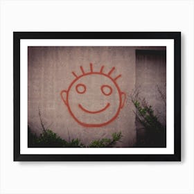 Graffiti Painting Of Red Happy Smiley Face On A Concrete Wall Art Print