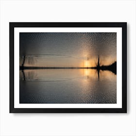 Reflection of golden sunlight in water at sunset Art Print