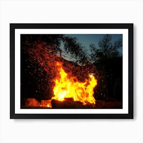 Sparks Bounce Off From A Bonfire At Night After A Log Thrown Into It Art Print