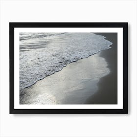 Silver-grey sea water on the sandy beach Art Print