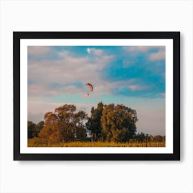 Motorized Paraglider Flying In Rural Area During Sunset Art Print