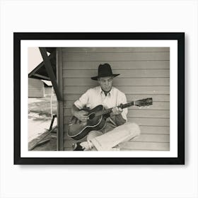 Migratory Worker Playing Guitar On Front Porch Of His Metal Shelter In The Agua Fria Labor Camp, Arizona By Russell Lee Art Print