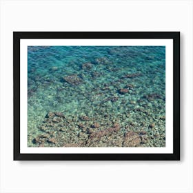 Clear blue sea water in a rocky bay Art Print