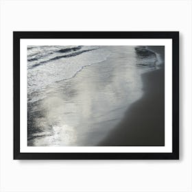 Silver reflections in wet sand on the beach Art Print