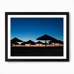Silhouette Of Umbrellas At Sunset Art Print