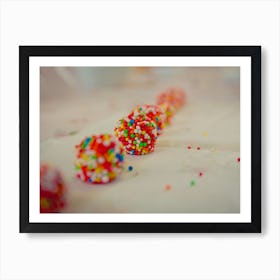 Close Up On White Chocolate Balls Covered With Candies Arranged In A Row Art Print