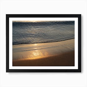 Sunrise and golden reflections at the beach Art Print