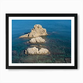 Rocks and clear blue sea water Art Print