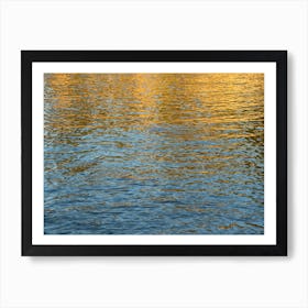 Golden reflections in blue sea water Art Print