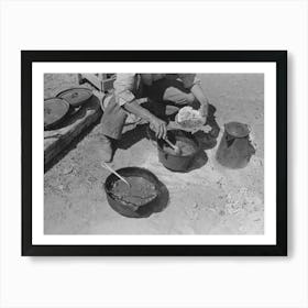 Cowboy Dishing Up Chili At Noonday Dinner, Cattle Ranch Near Marfa, Texas By Russell Lee Art Print