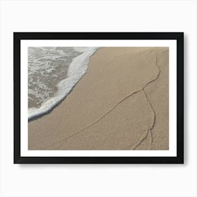 Sea water and traces of waves on the beach Art Print